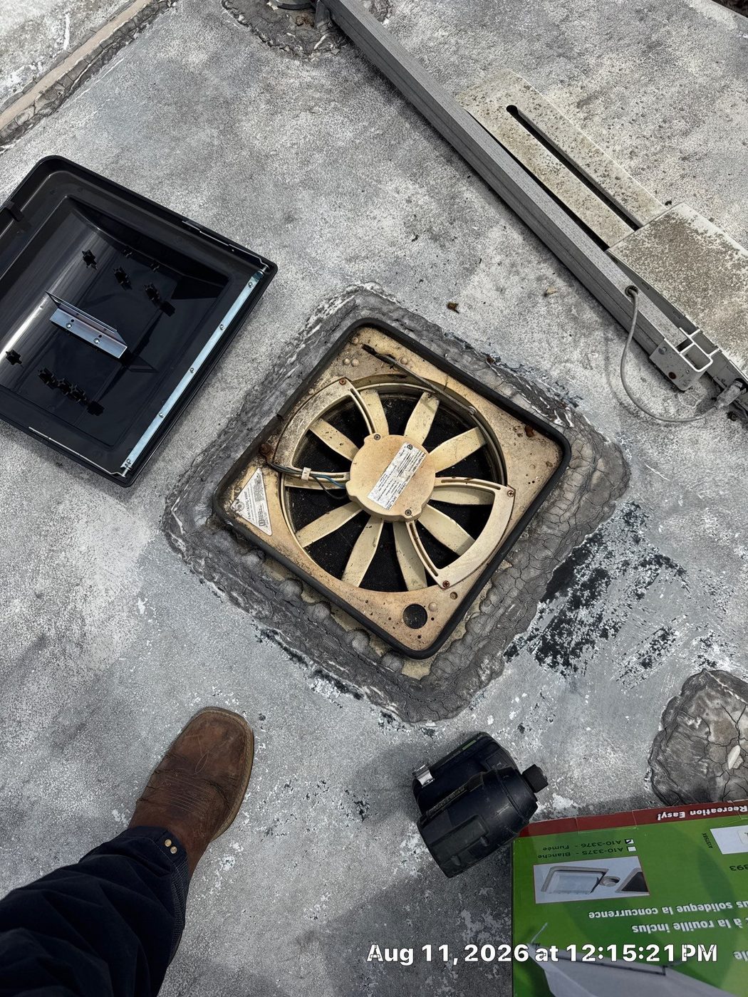 Cracked and crumbling lap sealant around an RV roof vent, a common RV roof leak point