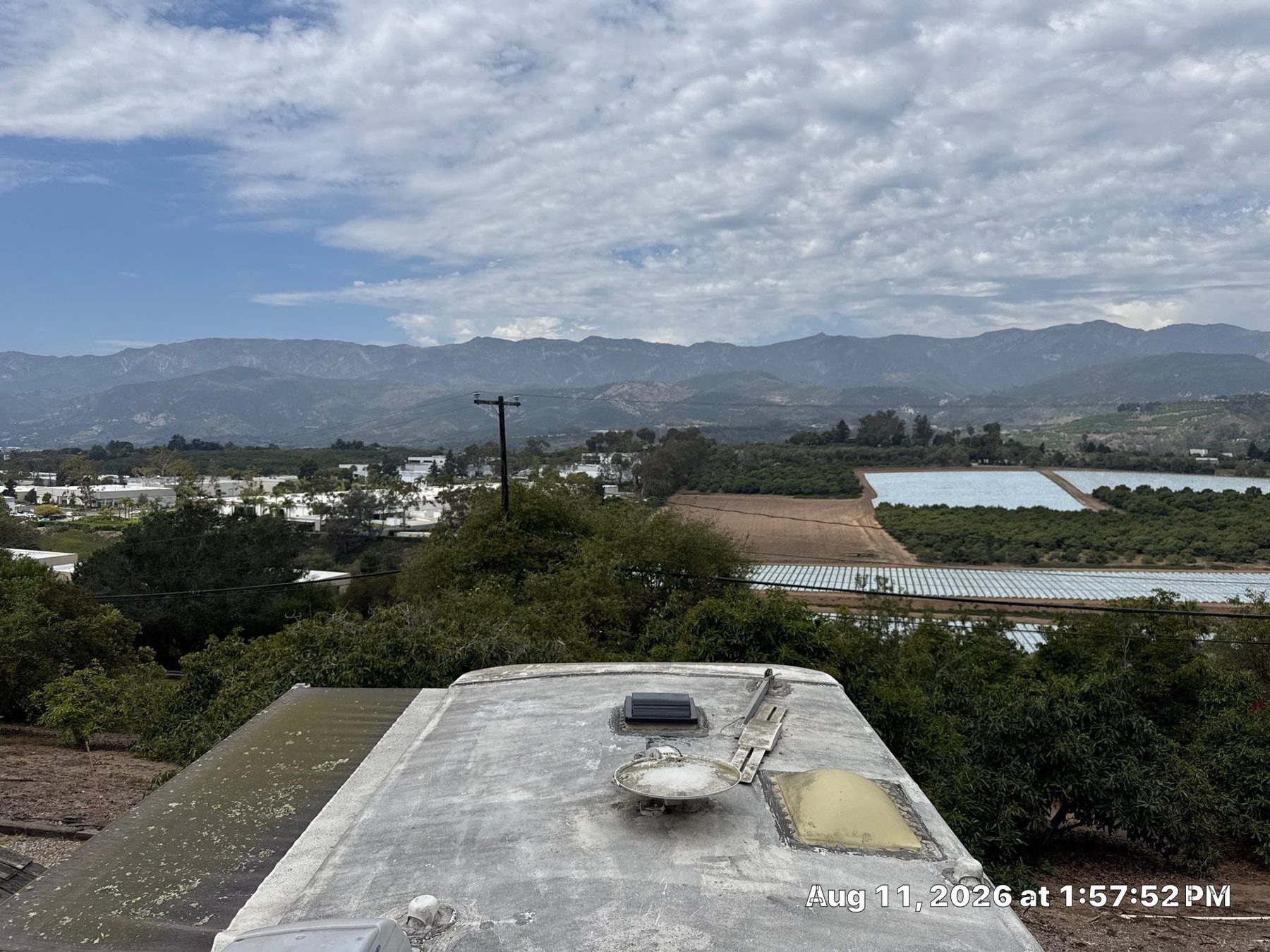 Weathered, chalky EPDM RV roof membrane overlooking the Santa Ynez Valley