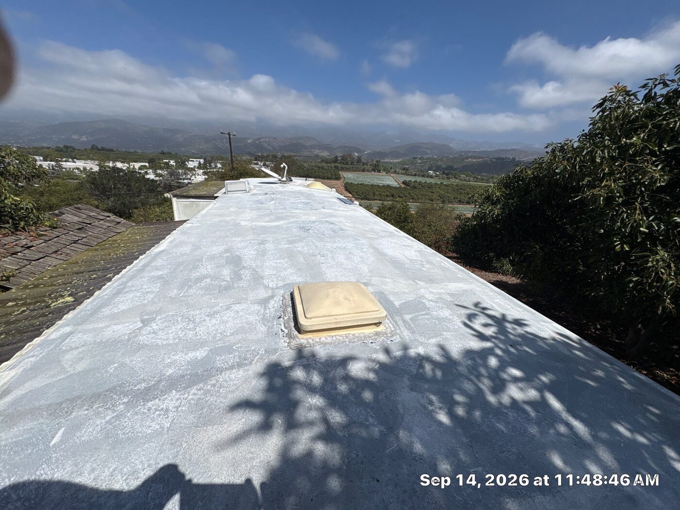 Heavily chalked, oxidized EPDM rubber RV roof at the end of its life on a fifth wheel in Carpinteria, before restoration